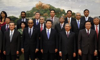Chinese President Xi Jinping, front center, presents using the various other government frontrunners and the visitors which attended the signing ceremony of this Asian Infrastruct...